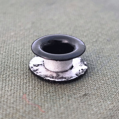 Aluminum grommet for field bottle cap