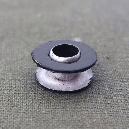Aluminum grommet for field bottle cap
