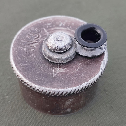 Aluminum grommet for field bottle cap