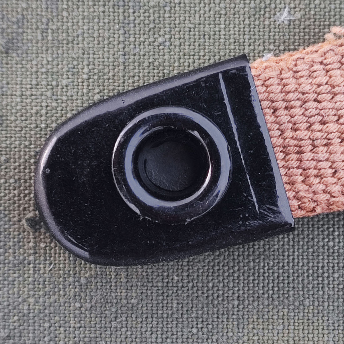Aluminum grommet for field bottle cap